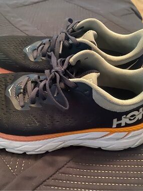 Hoka Running Sneakers in Black with Orange and White Details
